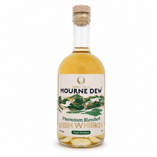 A bottle of Mourne Dew Premium Blended Irish Whiskey Triple Distilled, featuring a clear glass bottle with amber-colored whiskey, a light wood cork stopper, and a cream-colored label with green and gold illustrations.